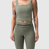 W030 Lycra 3-in-1 Legging in sage worn with matching crop tank and belt bag