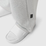 Heather grey Sorona Terry straight leg sweats on model wearing white slides, detail view
