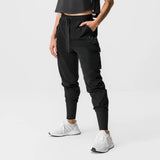 Black Tetra-Lite® Cargo High Rib Jogger worn by model with white sneakers, front view