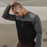 AEROSILVER UPF50+ Run Long Sleeve in black and gray colorblock, worn by model outdoors