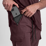 Tetra-Lite Cargo High Rib Jogger in Faded Plum, model holding phone in cargo pocket