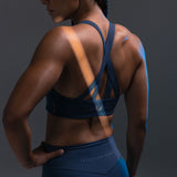 LYCRA® Hybrid Sports Bra in Storm blue, back view on model