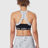 W083 LYCRA® ADAPTIV Racerback Sports Bra in Sedona Snow Camo, back view on model