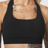 W096 LYCRA® ADAPTIV Racerback Sports Bra in black, front view on model