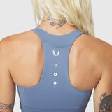 W096 LYCRA® ADAPTIV Racerback Sports Bra in Slate Blue, back view on model