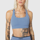 W096 LYCRA® ADAPTIV Racerback Sports Bra in Slate Blue, front view on model
