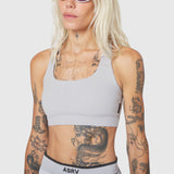 W096 LYCRA® ADAPTIV Racerback Sports Bra in Slate Grey, front view on model