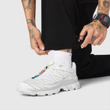 W100 2-in-1 Convertible Pant in black worn by model with white sneaker