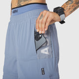 W100 2-in-1 Convertible Pant in Slate Blue, worn with phone in pocket